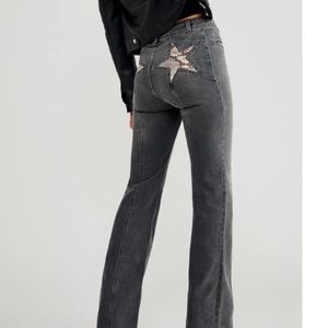 Free People Firecracker snake print flare jeans